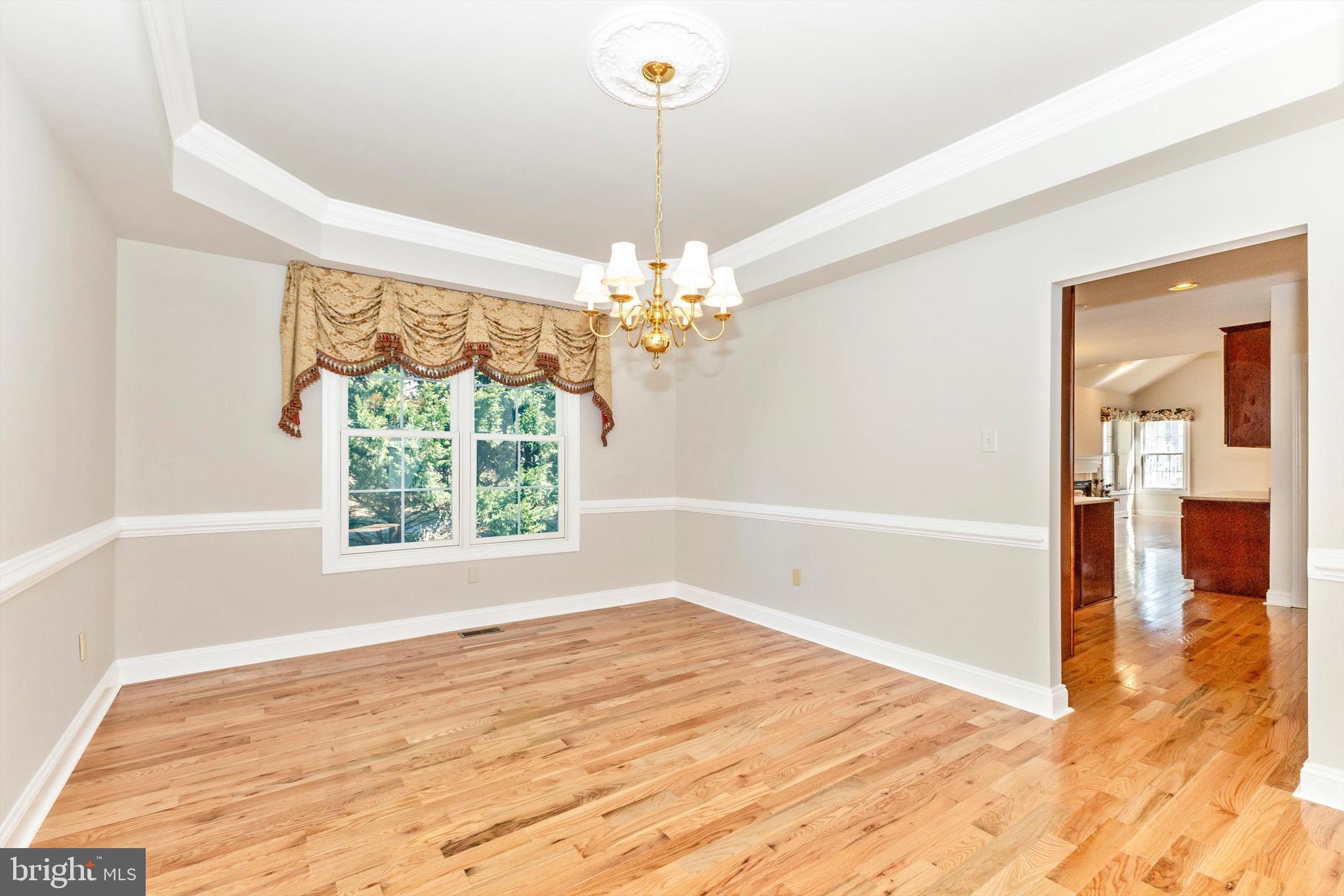 10213 Deep Skies Drive Laurel, MD 20723 - Photo 15 of 56 a view of a room with window and wooden floor