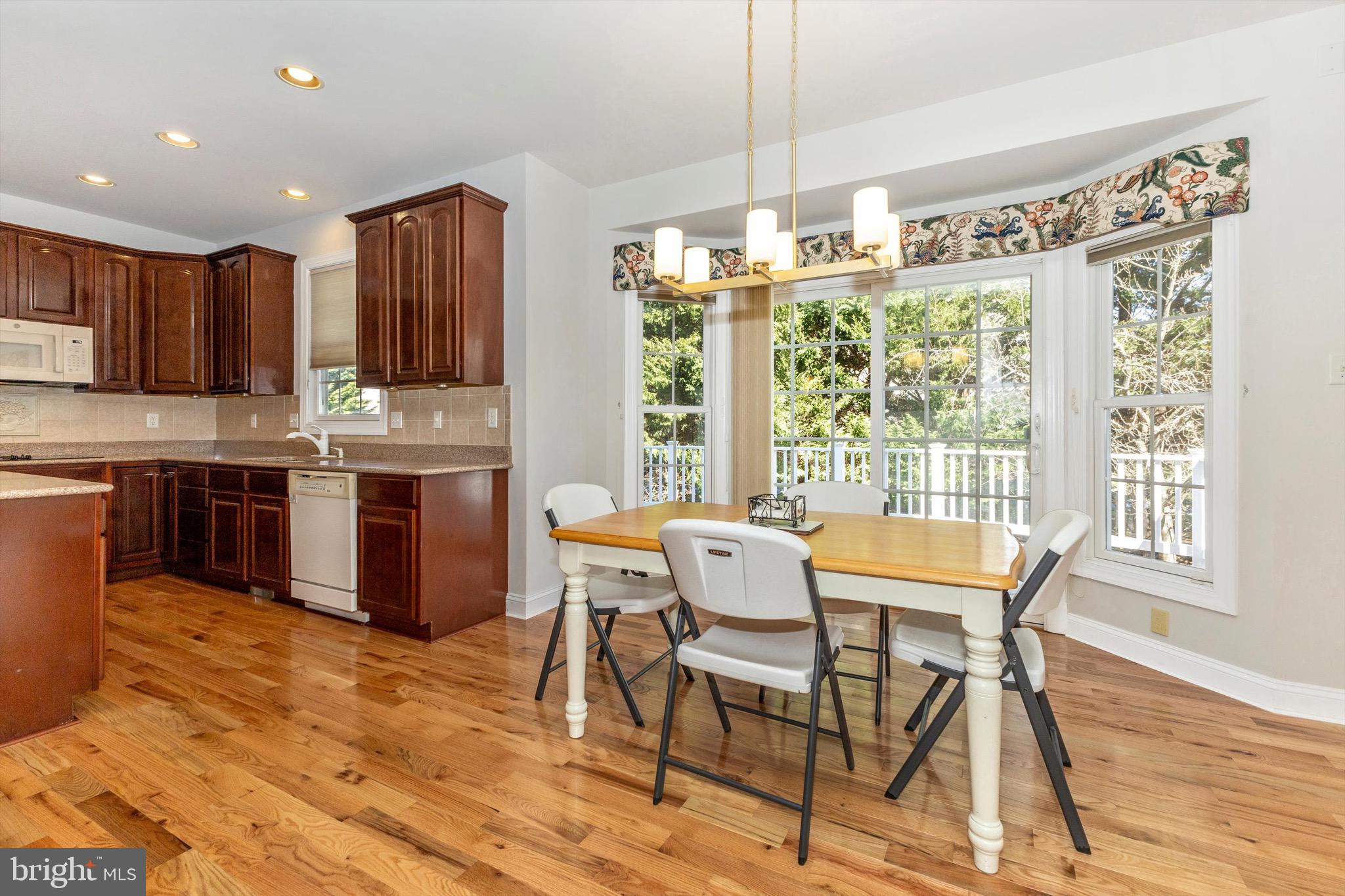 10213 Deep Skies Drive Laurel, MD 20723 - Photo 21 of 56 a view of a dining room with furniture window and wooden floor
