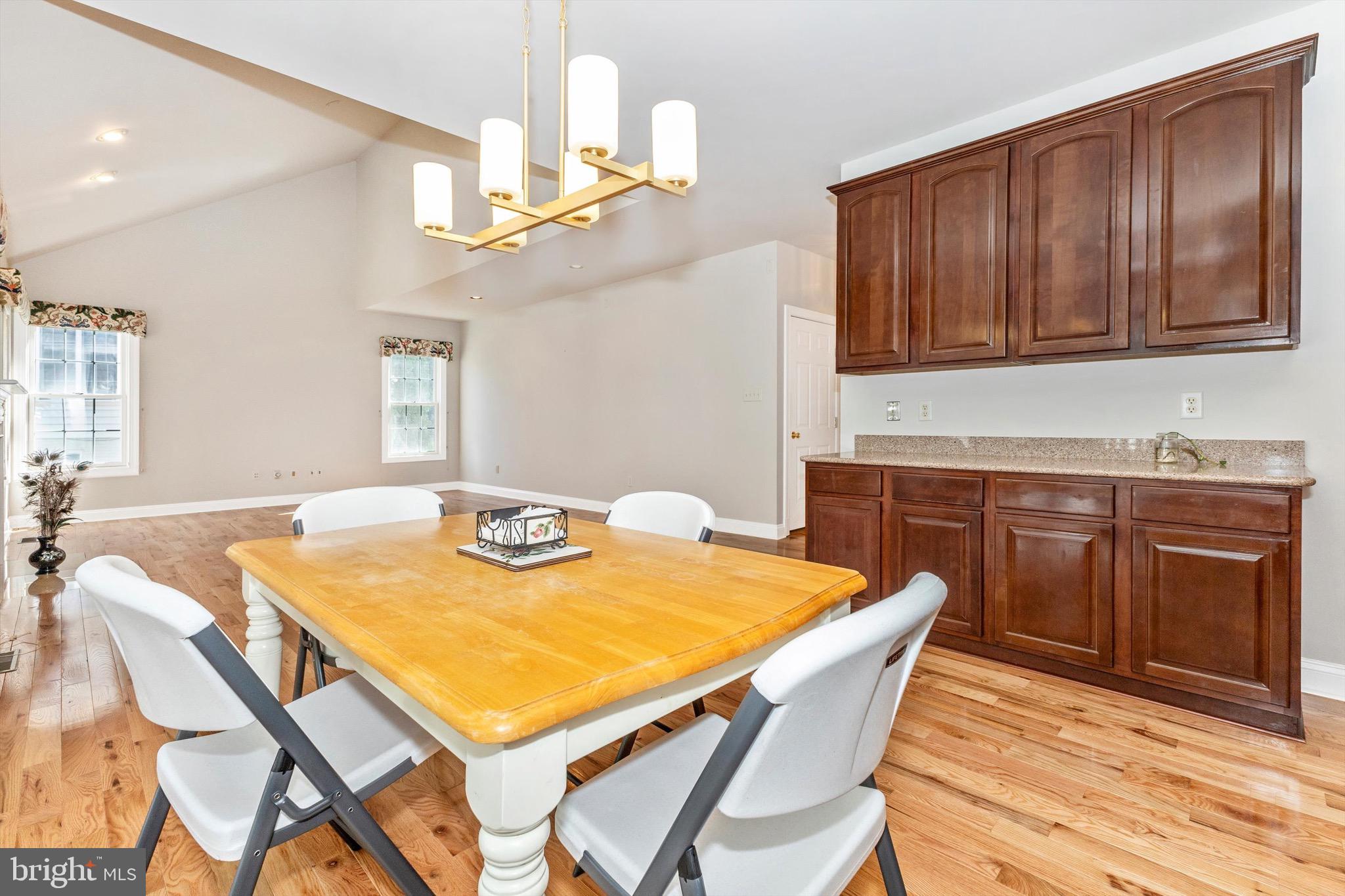 10213 Deep Skies Drive Laurel, MD 20723 - Photo 23 of 56 a dining room with wooden floor
