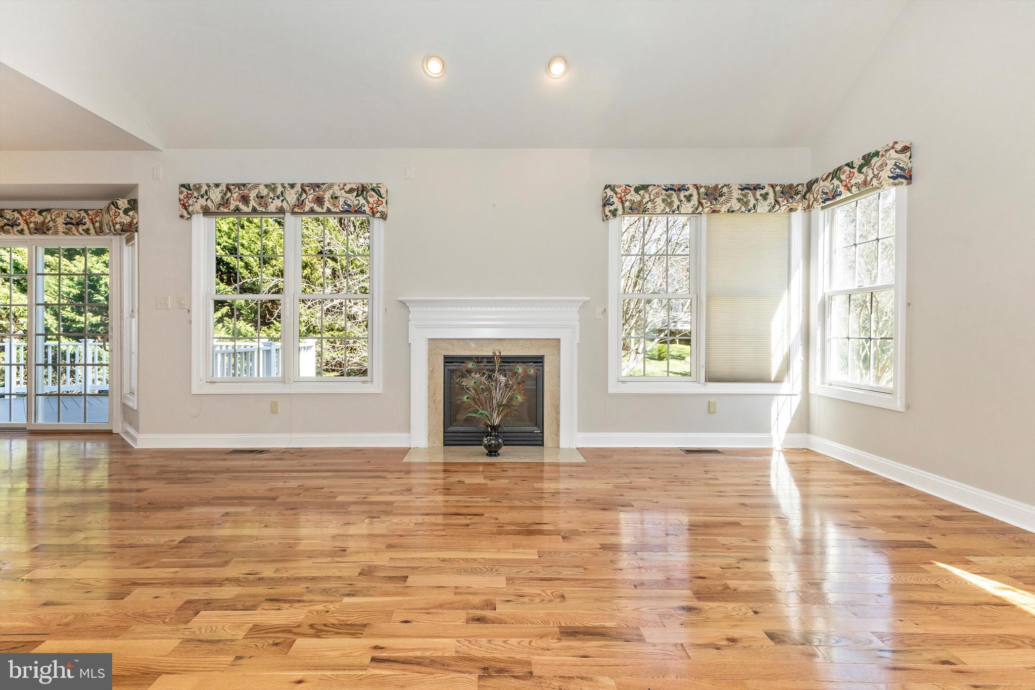 10213 Deep Skies Drive Laurel, MD 20723 - Photo 26 of 56 a view of an empty room with window and fire place