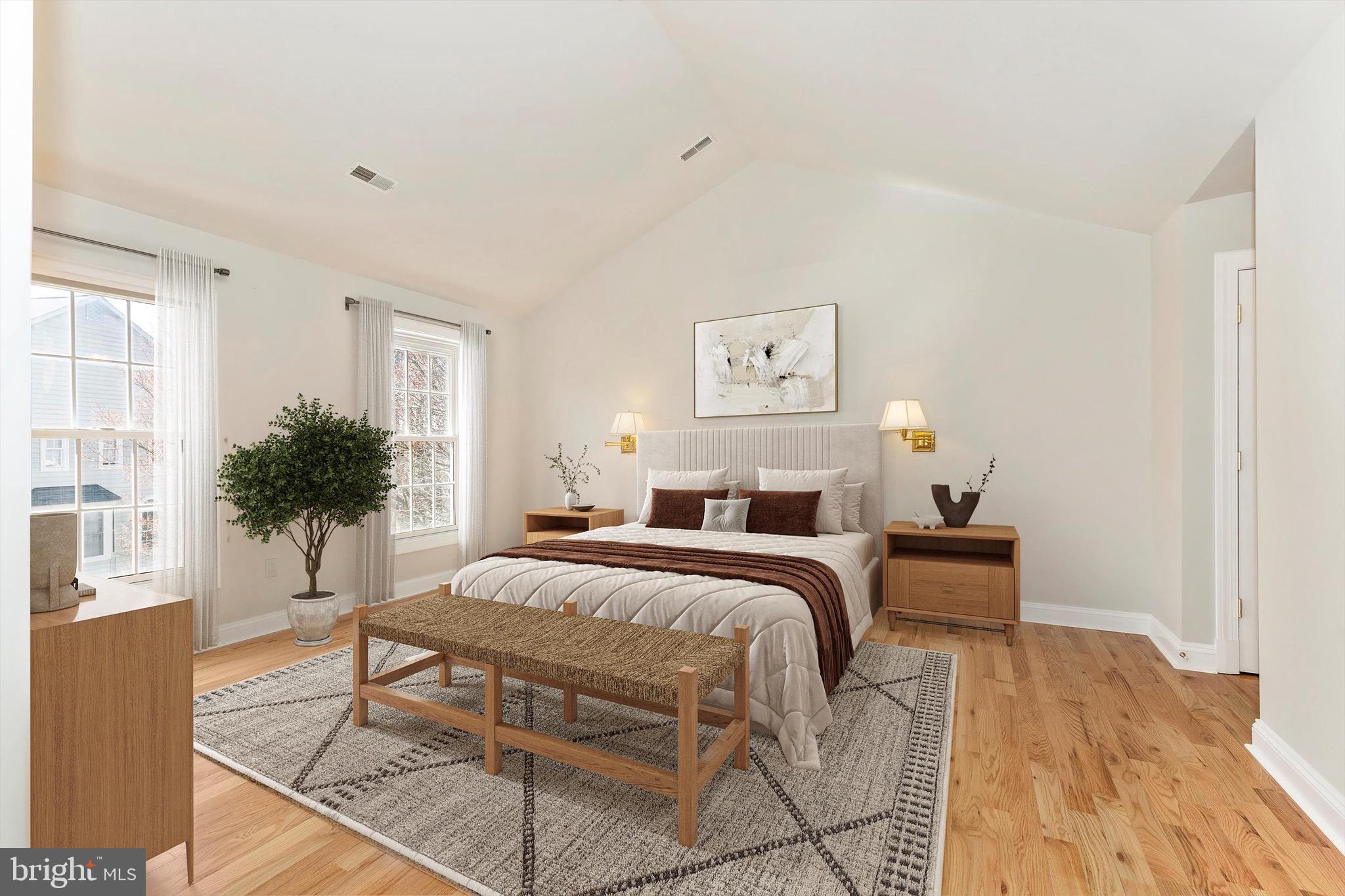 10213 Deep Skies Drive Laurel, MD 20723 - Photo 32 of 56 a bedroom with a bed and a potted plant