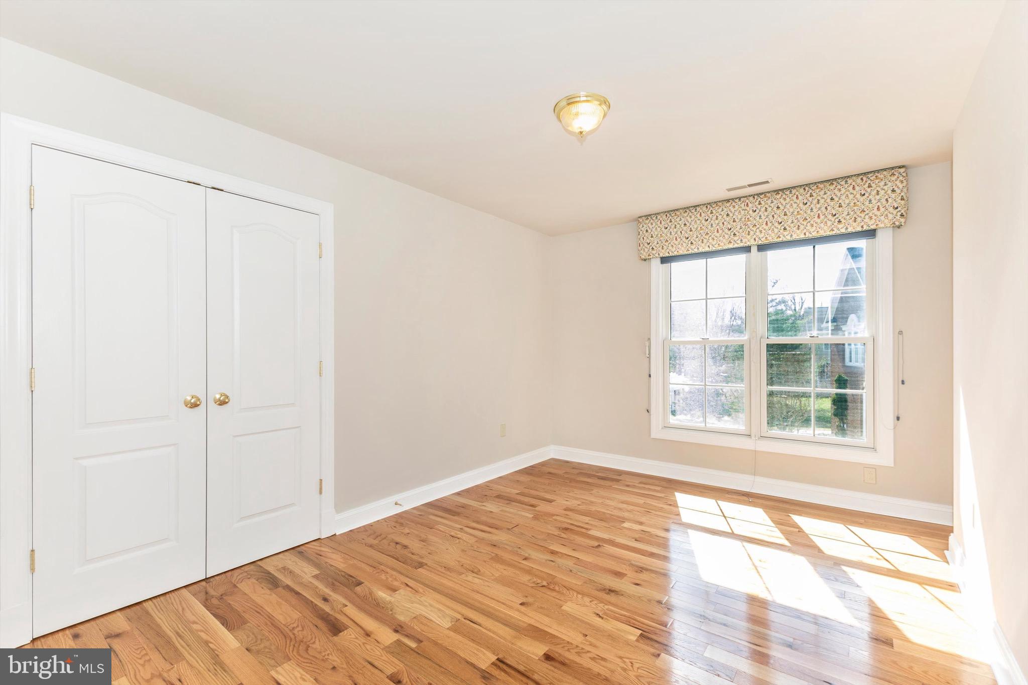 10213 Deep Skies Drive Laurel, MD 20723 - Photo 37 of 56 a view of empty room with wooden floor and fan