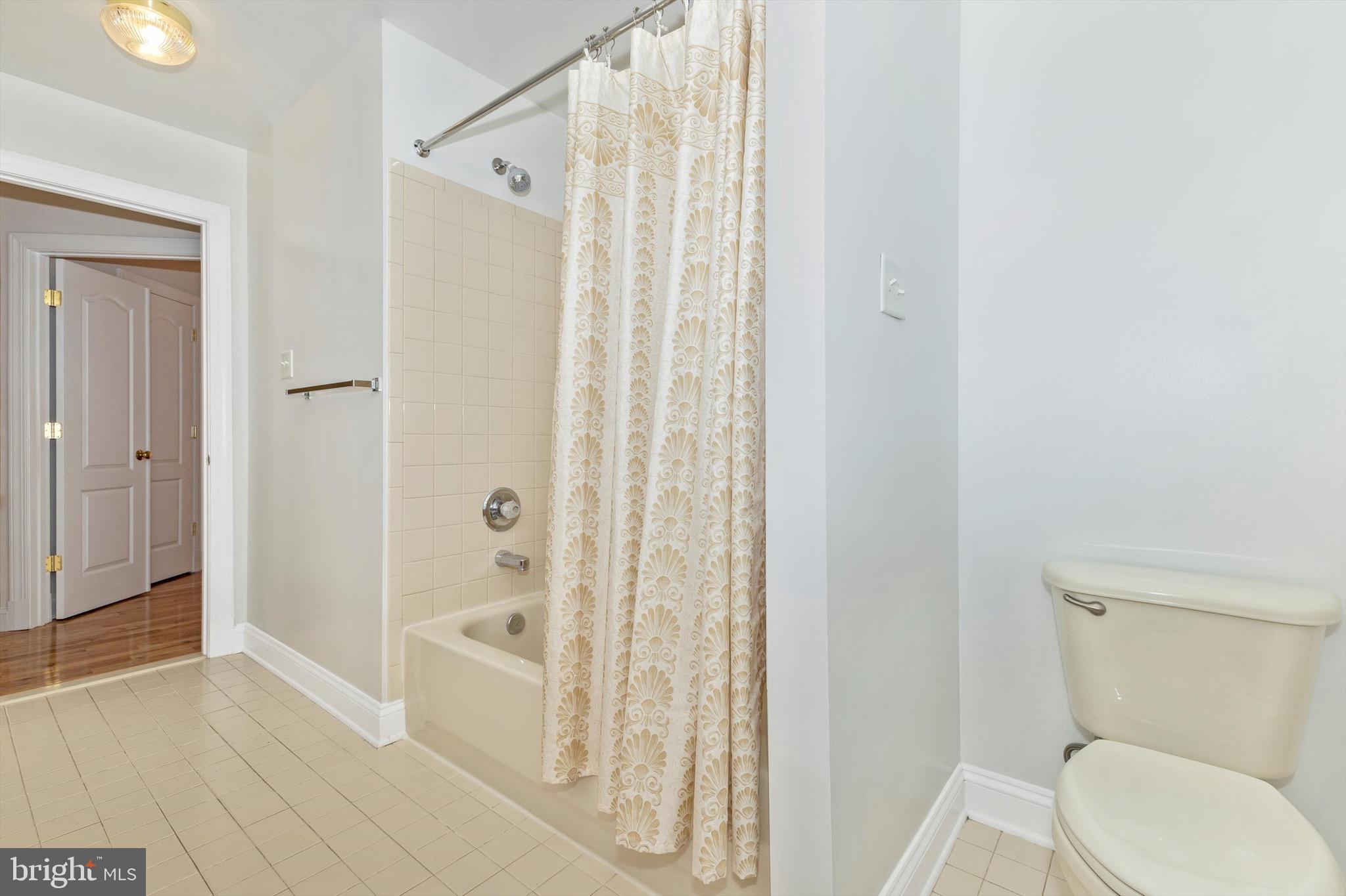 10213 Deep Skies Drive Laurel, MD 20723 - Photo 44 of 56 a bathroom with a toilet and shower
