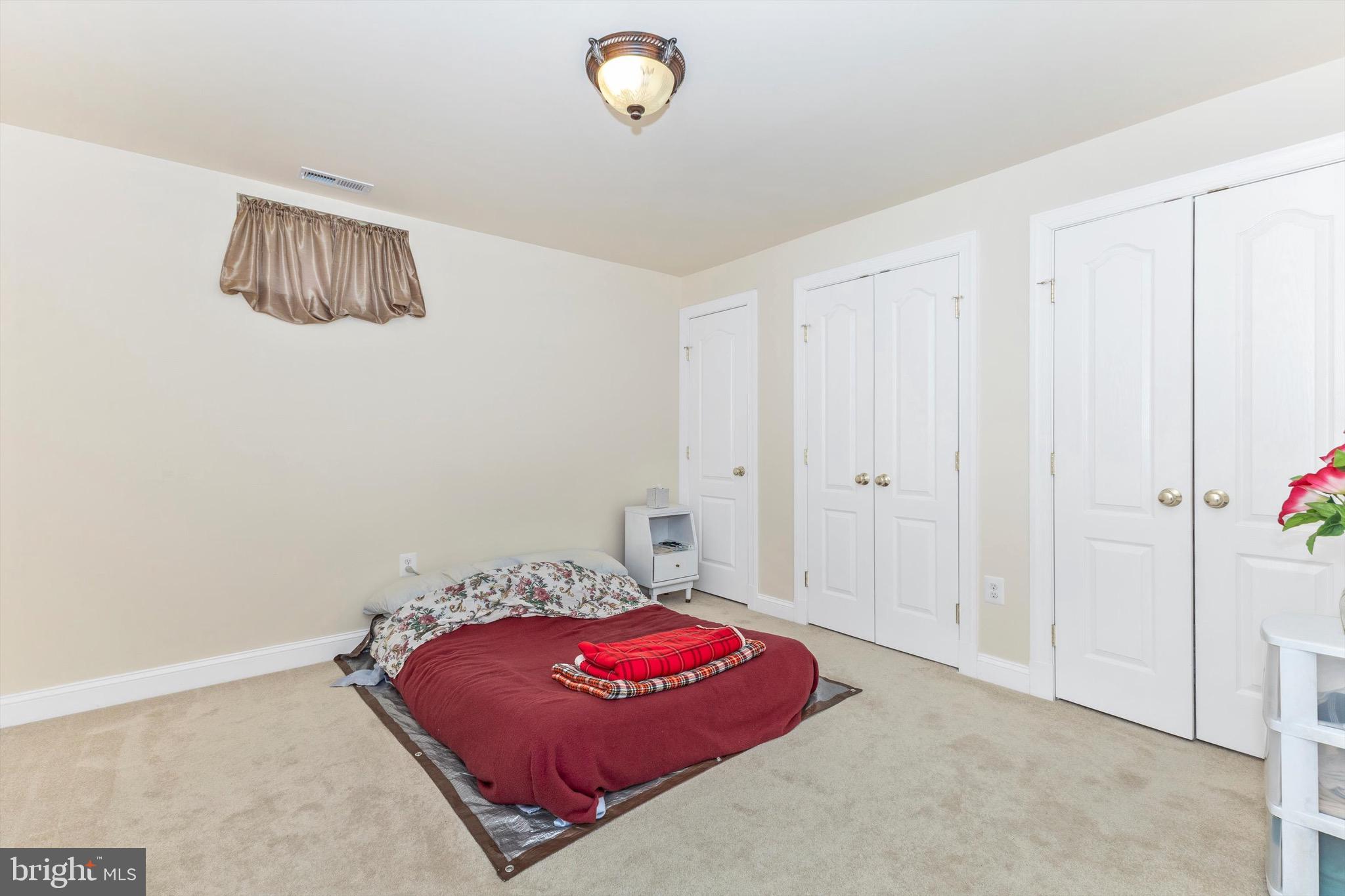 10213 Deep Skies Drive Laurel, MD 20723 - Photo 51 of 56 a bedroom with a bed and a window