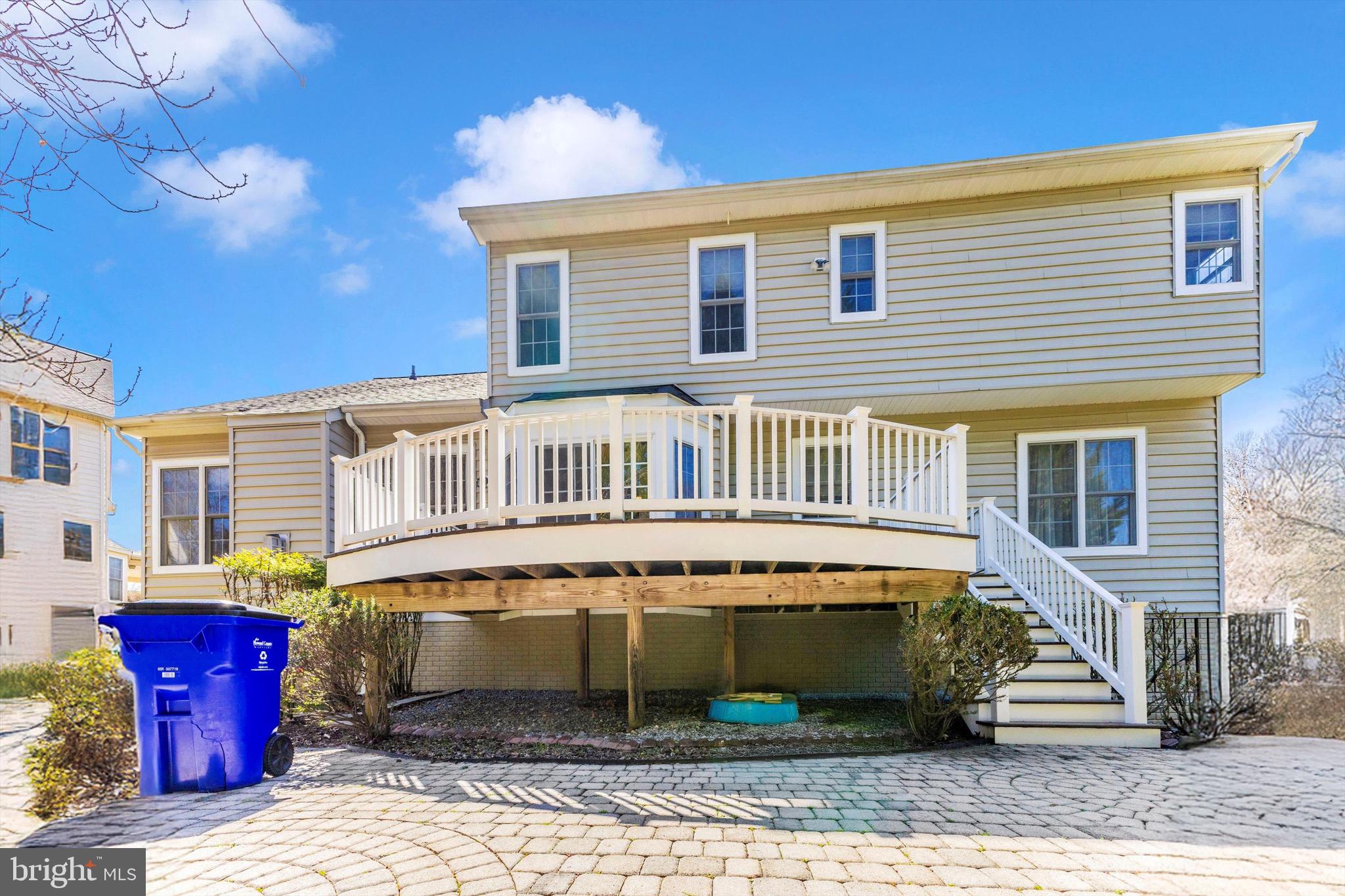 10213 Deep Skies Drive Laurel, MD 20723 - Photo 6 of 56 a front view of a house with garden