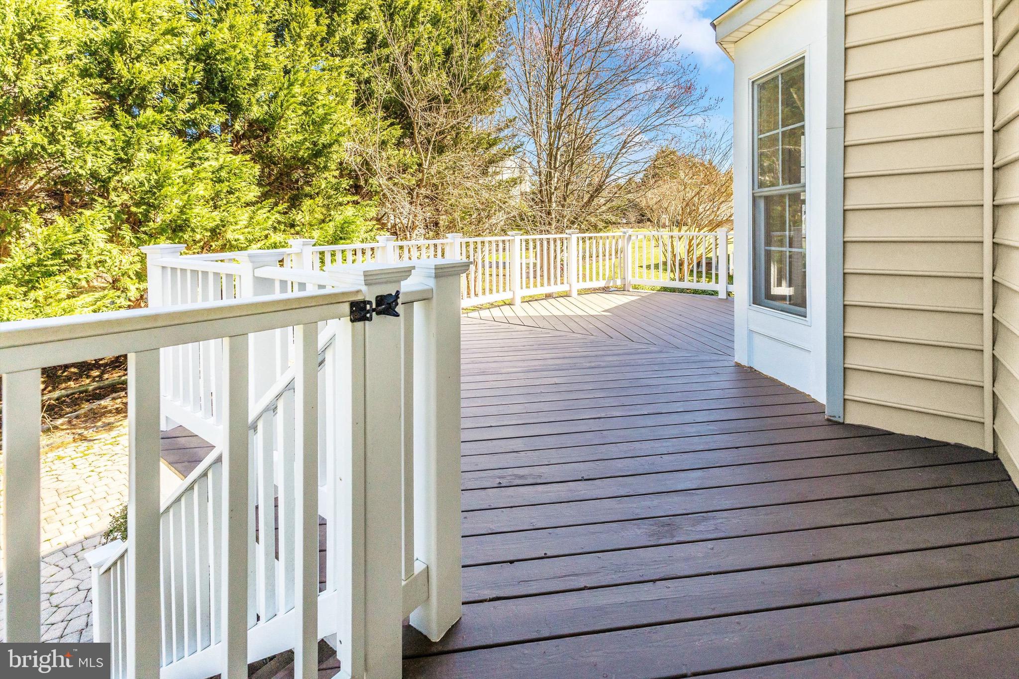 10213 Deep Skies Drive Laurel, MD 20723 - Photo 9 of 56 a view of a deck with wooden floor and a yard