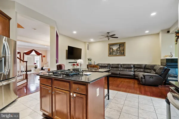 a kitchen with stainless steel appliances a stove a sink and cabinets