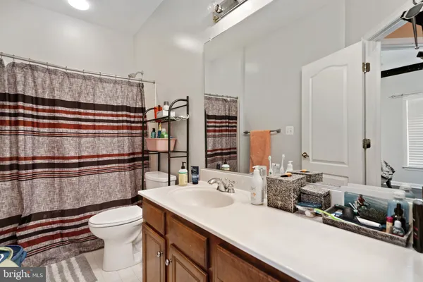 a bedroom with a bed and a table