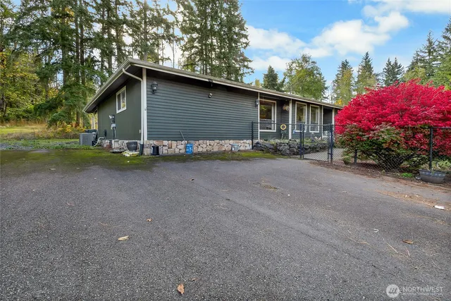 a view of a house with a yard and garage