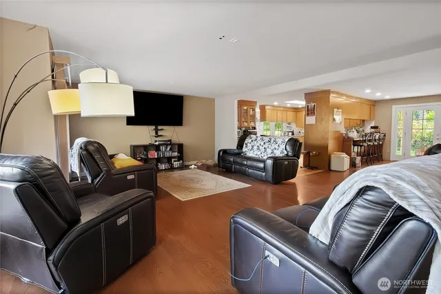 a living room with furniture and flat screen tv
