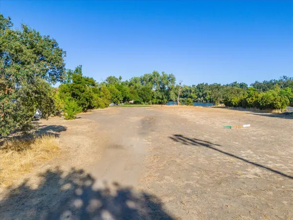 a view of a lake with a yard