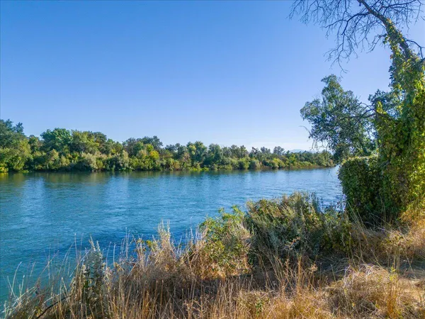 a view of lake with green space