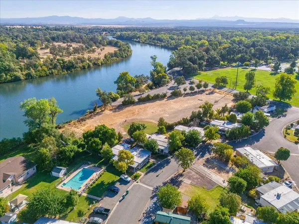 an aerial view of a city and lake view