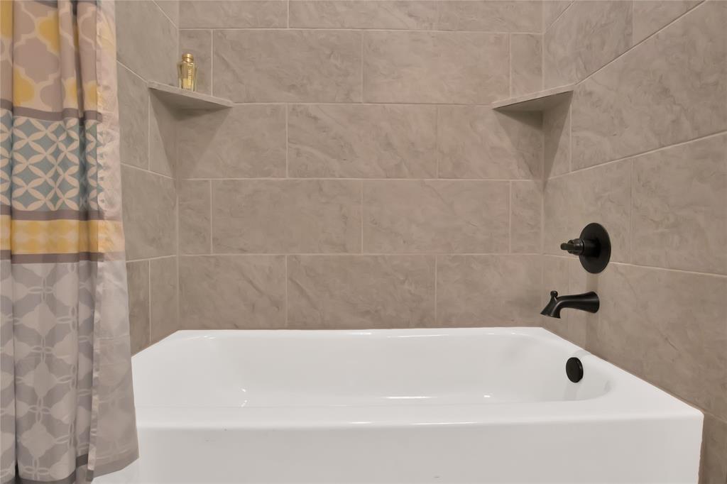 111 Panther Loop Mabank, TX 75147 - Photo 21 of 27 Hand-tiled wall and steel tub in 2nd bath