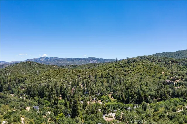 a view of a town with mountains in the background