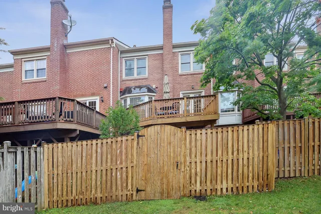 a view of a wooden house with a yard