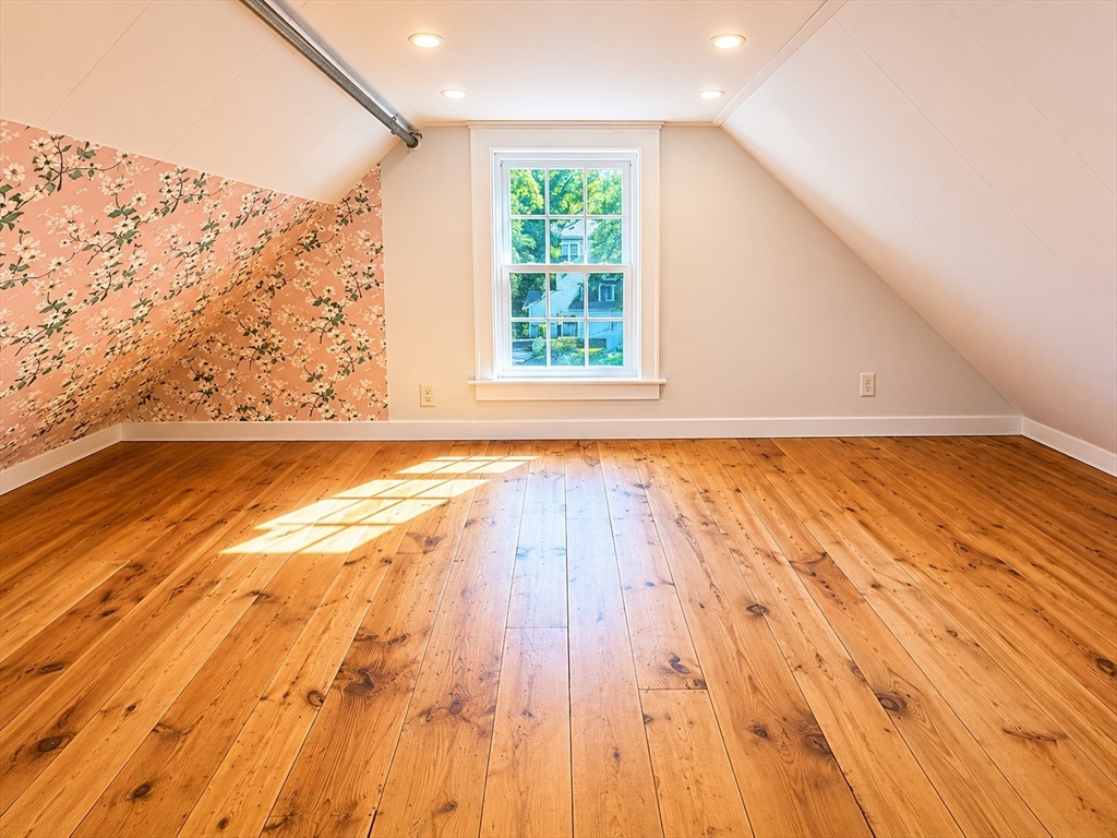 36 Plummer Avenue Lowell, MA 01852 - Photo 22 of 23 a view of an empty room with wooden floor and a window