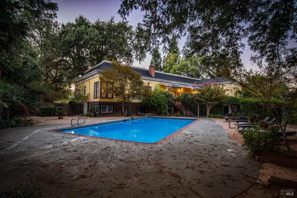 an aerial view of a house with a ocean view