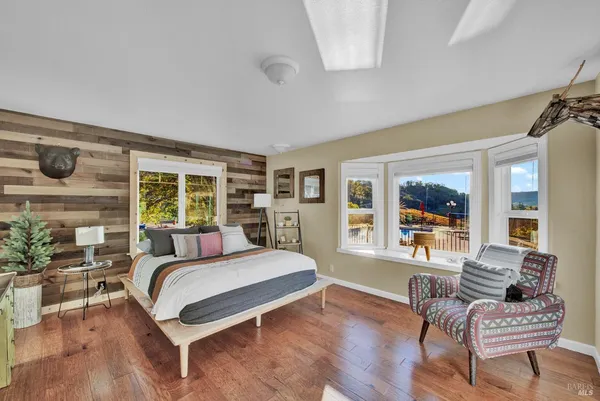 a bathroom with a toilet a sink and a window