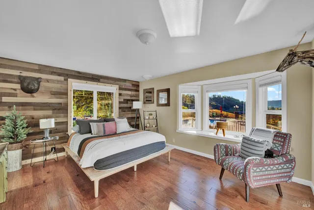 a bathroom with a toilet a sink and a window