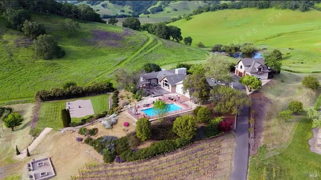 an aerial view of a house with a garden
