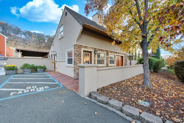 an aerial view of a house with mountain view