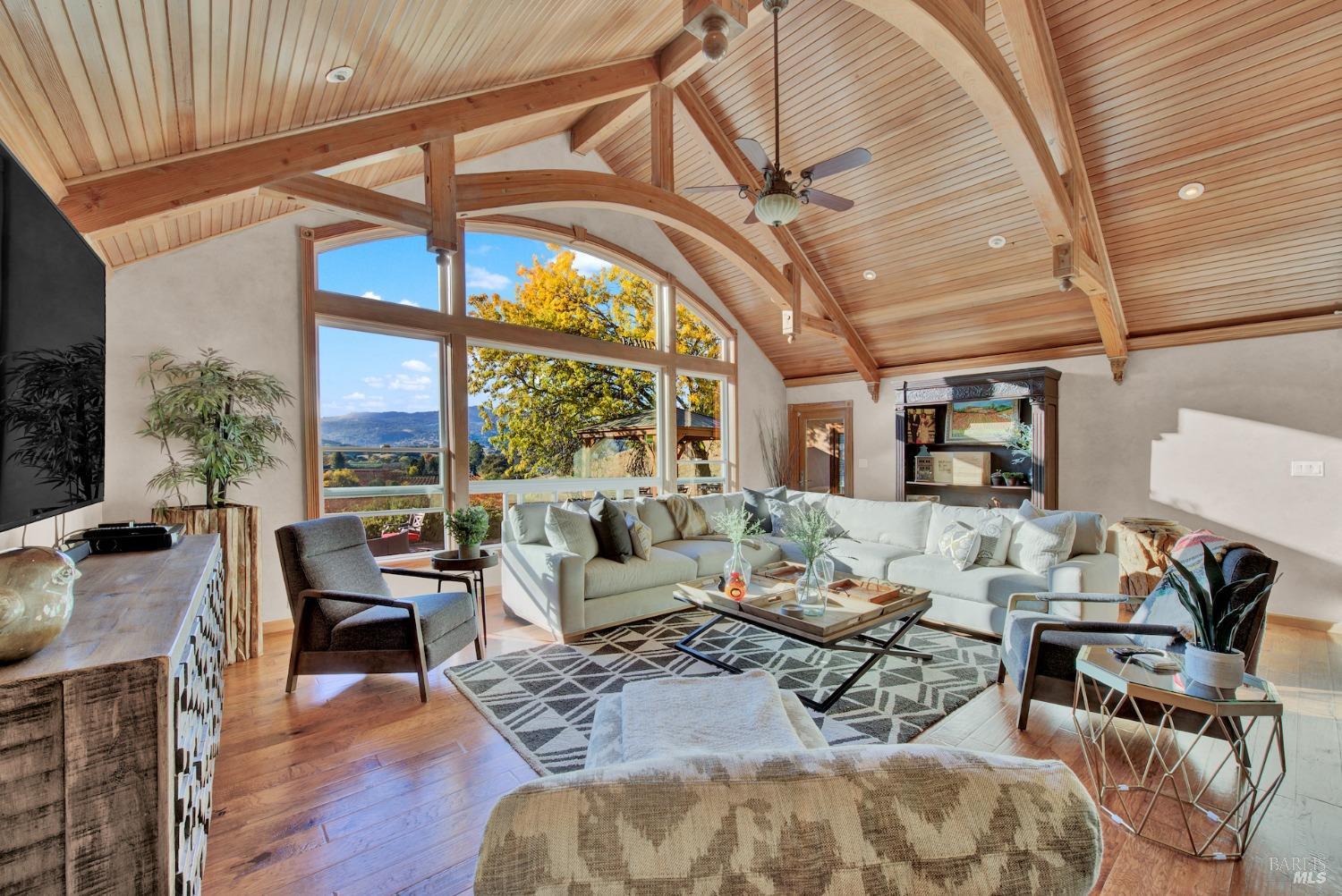 5066 Clayton Road Fairfield, CA 94534 - Photo 71 of 75 a living room with furniture a wooden floor and next to a window