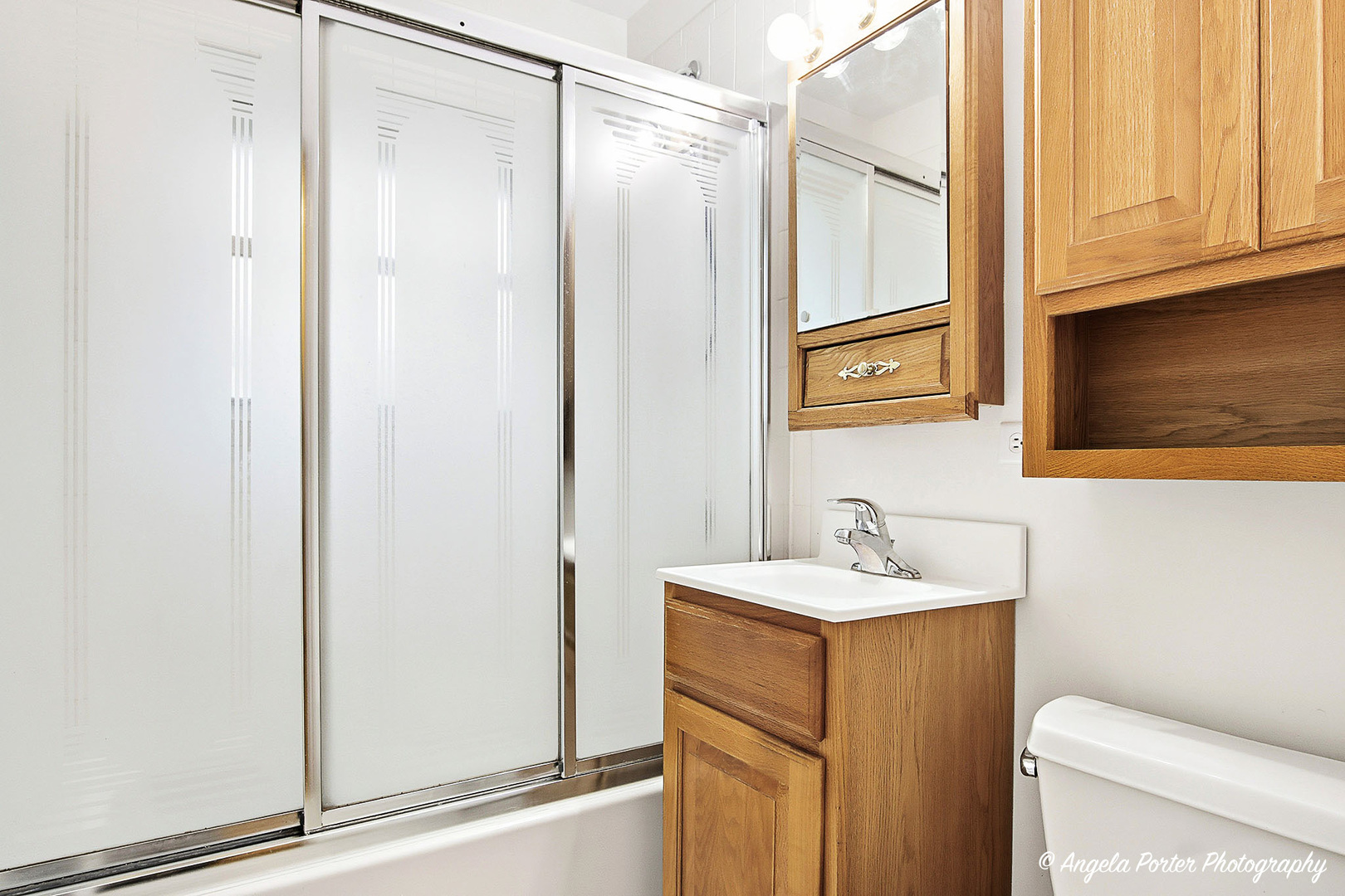 453 Willow Road Wauconda, IL 60084 - Photo 12 of 29 a bathroom with a sink and a mirror