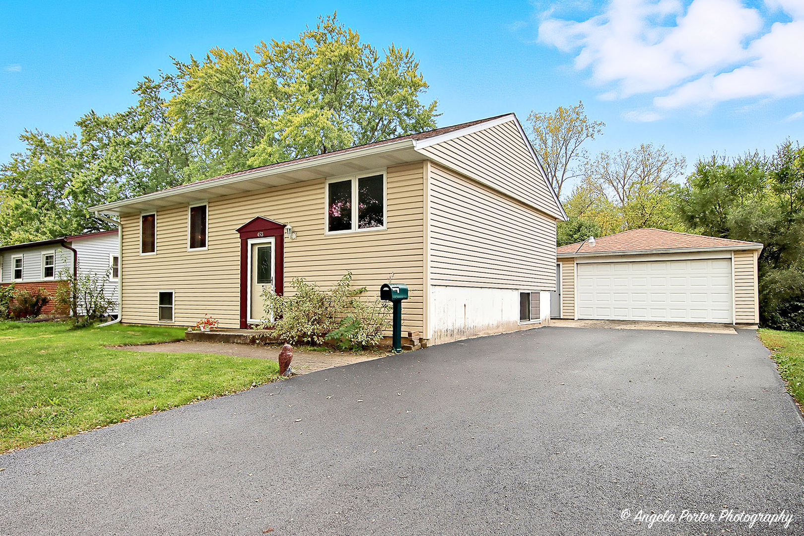 453 Willow Road Wauconda, IL 60084 - Photo 2 of 29 a view of a house with a yard and garage