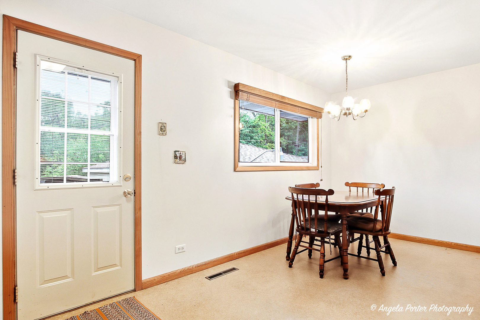 453 Willow Road Wauconda, IL 60084 - Photo 21 of 29 a view of a dining room with furniture and chandelier