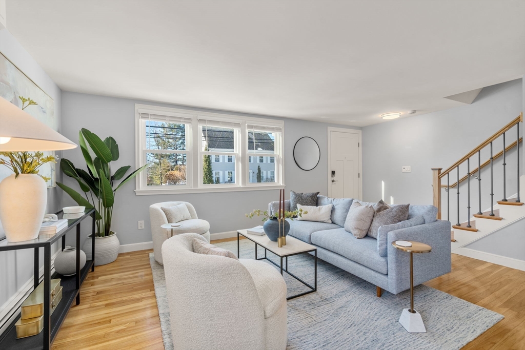 266 Hunnewell Street, Unit 266 Needham, MA 02494 - Photo 1 of 39 a living room with furniture and a large window