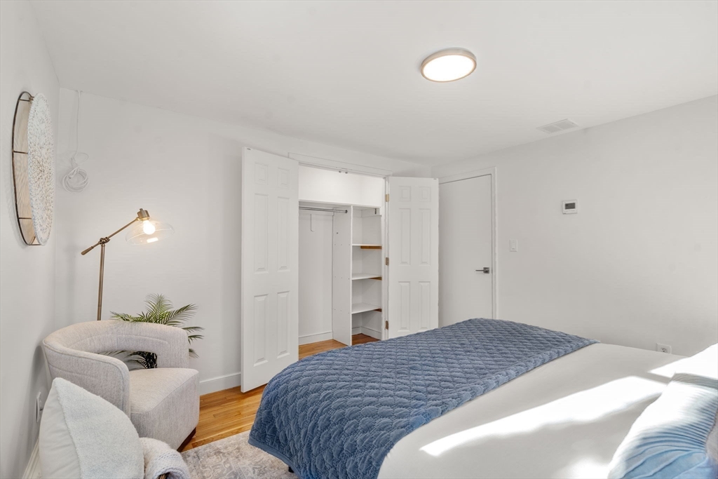 266 Hunnewell Street, Unit 266 Needham, MA 02494 - Photo 19 of 39 a bedroom with a bed and a couch