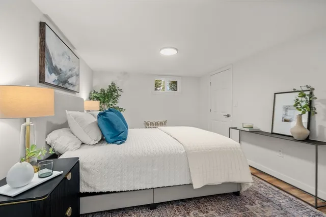 a bedroom with a bed and dresser