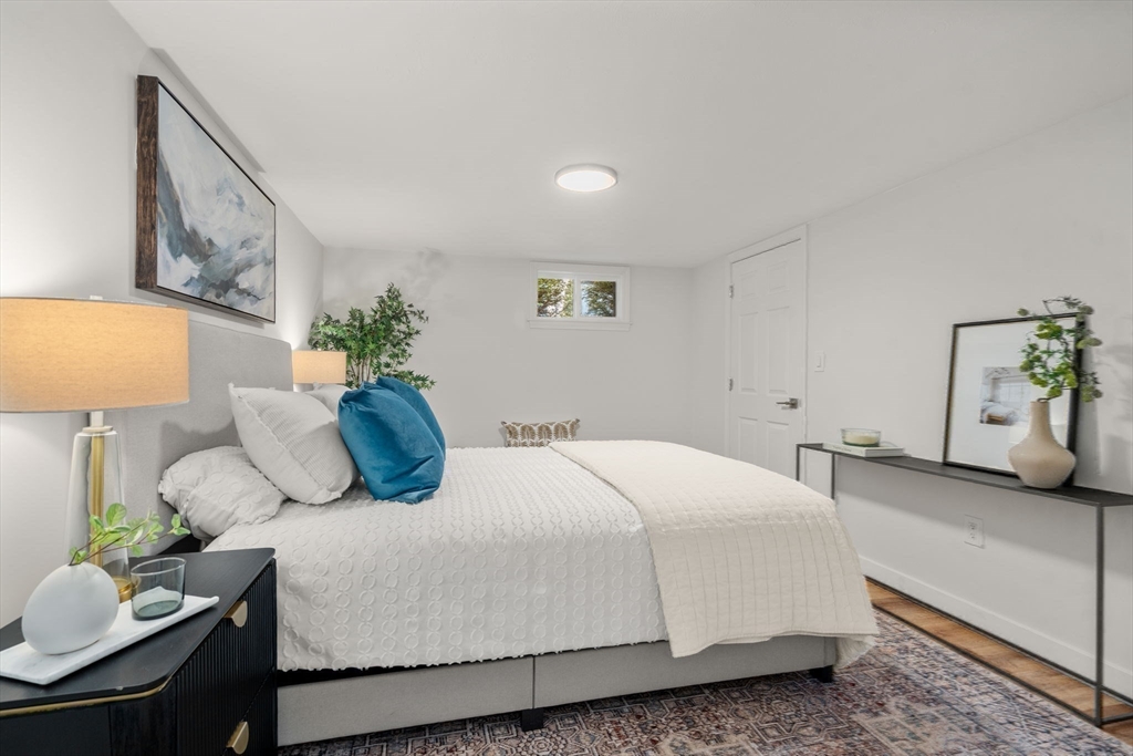 266 Hunnewell Street, Unit 266 Needham, MA 02494 - Photo 29 of 39 a bedroom with a bed and dresser