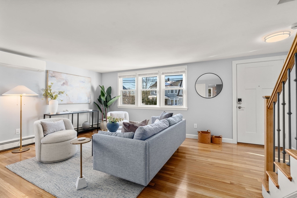 266 Hunnewell Street, Unit 266 Needham, MA 02494 - Photo 3 of 39 a living room with furniture and a large window