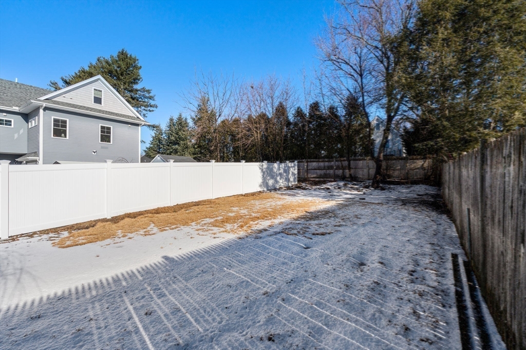 266 Hunnewell Street, Unit 266 Needham, MA 02494 - Photo 36 of 39 a house with trees in the background
