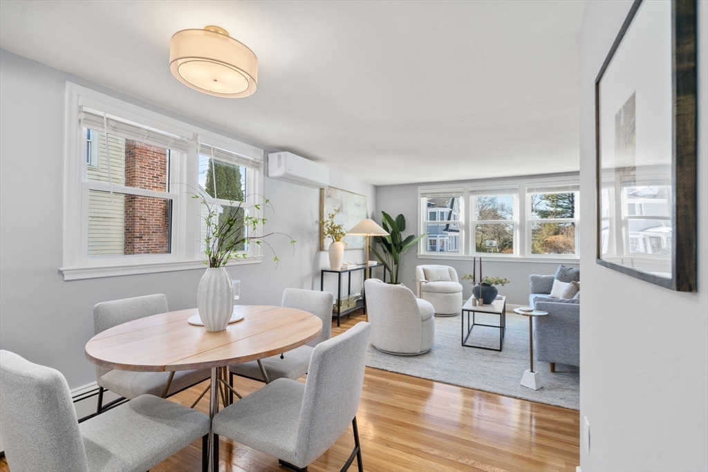 266 Hunnewell Street, Unit 266 Needham, MA 02494 - Photo 7 of 39 a view of a dining room with furniture and wooden floor