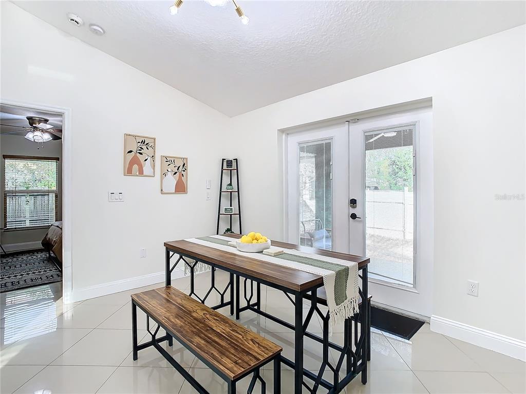 2907 West Arch Street Tampa, FL 33607 - Photo 14 of 48 a view of a dining room with furniture and a table