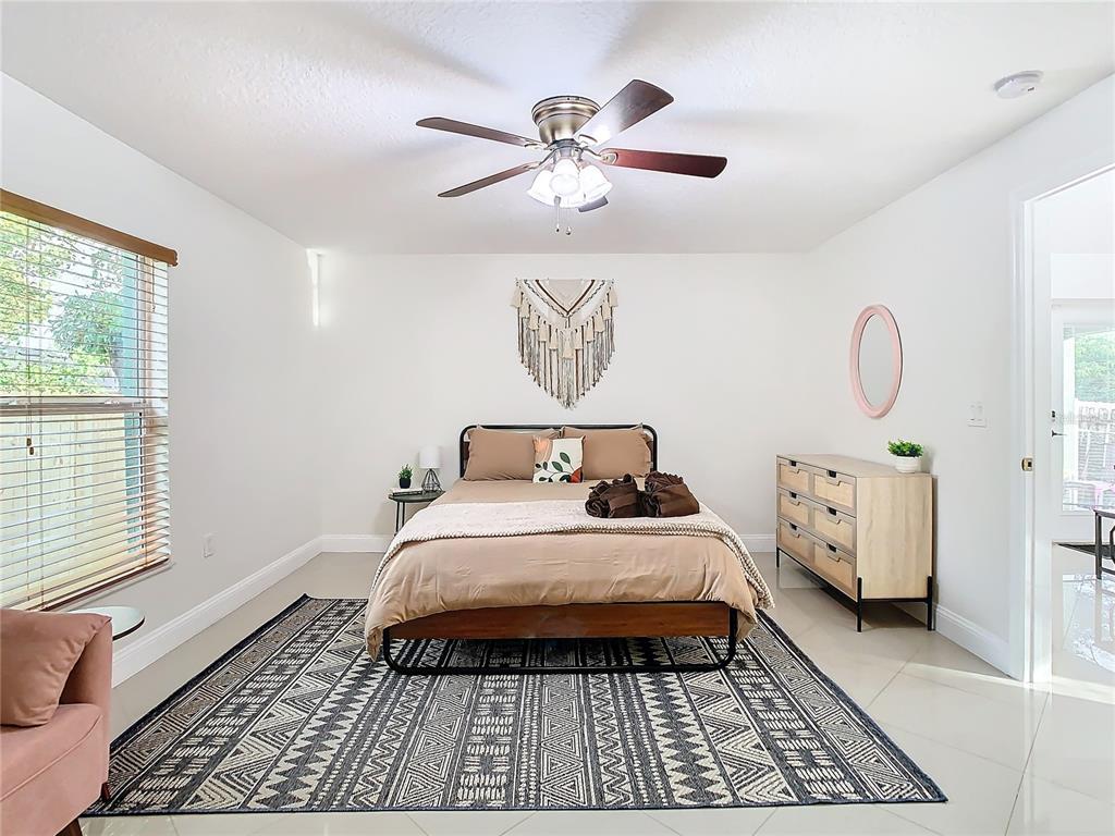 2907 West Arch Street Tampa, FL 33607 - Photo 17 of 48 a bed sitting in a bedroom next to a window