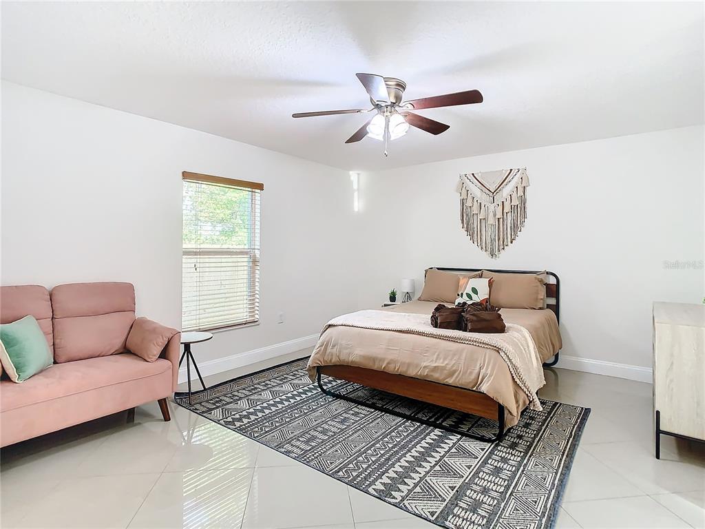 2907 West Arch Street Tampa, FL 33607 - Photo 18 of 48 a bedroom with a bed and a couch