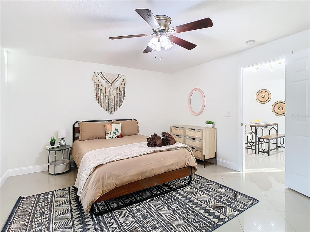 2907 West Arch Street Tampa, FL 33607 - Photo 19 of 48 a bedroom with a bed and a table