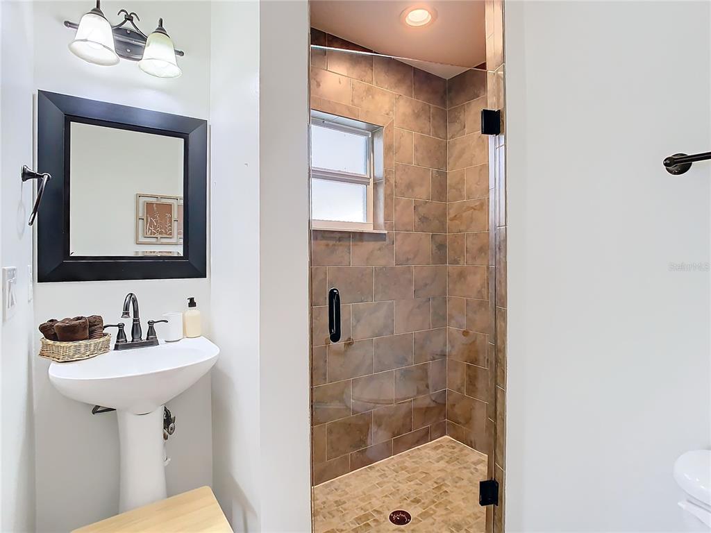 2907 West Arch Street Tampa, FL 33607 - Photo 34 of 48 a bathroom with a toilet sink and mirror