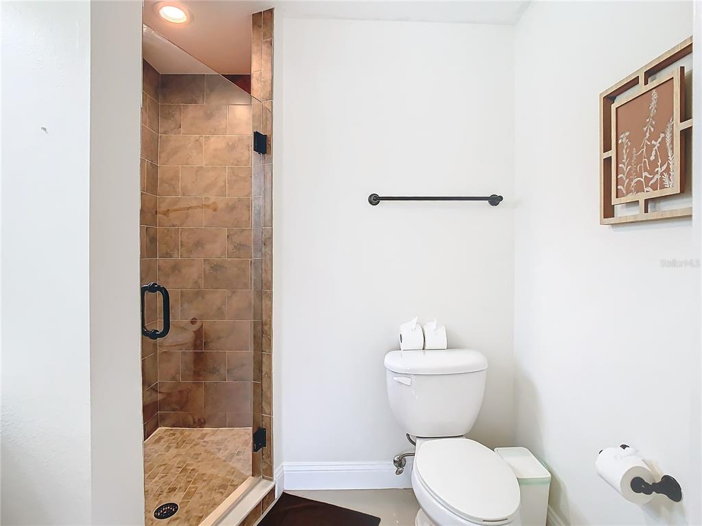 2907 West Arch Street Tampa, FL 33607 - Photo 35 of 48 a bathroom with a toilet and a shower