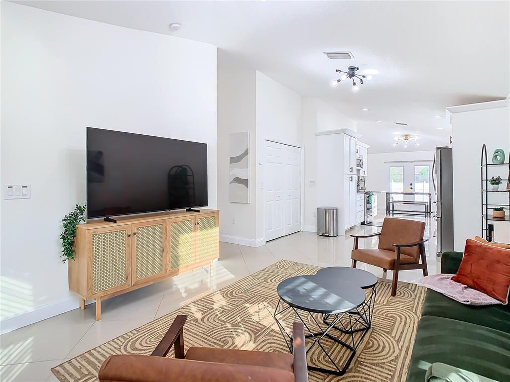 2907 West Arch Street Tampa, FL 33607 - Photo 5 of 48 a living room with furniture and a flat screen tv
