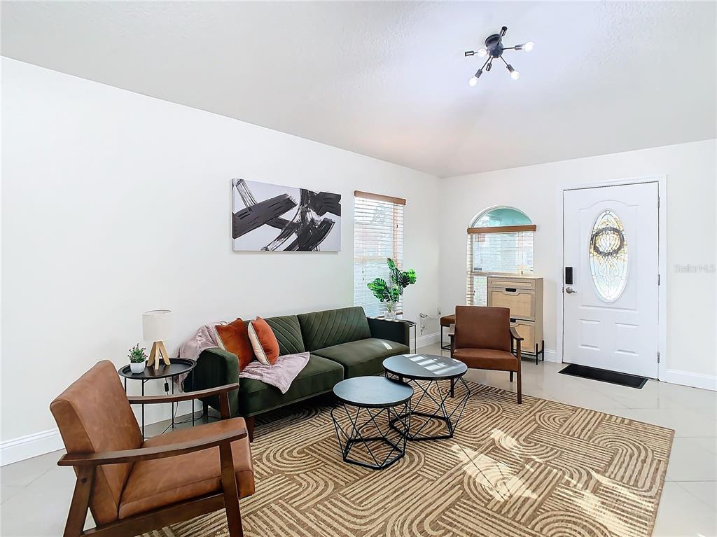 2907 West Arch Street Tampa, FL 33607 - Photo 7 of 48 a living room with furniture and wooden floor