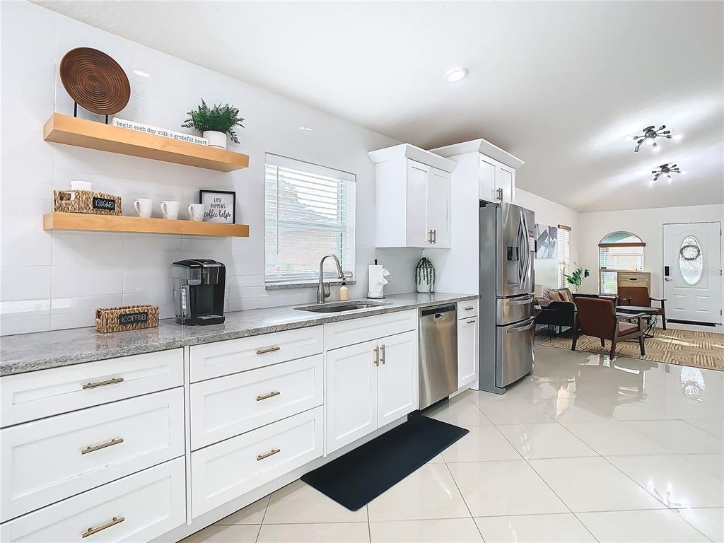 2907 West Arch Street Tampa, FL 33607 - Photo 10 of 48 a kitchen with a sink and cabinets