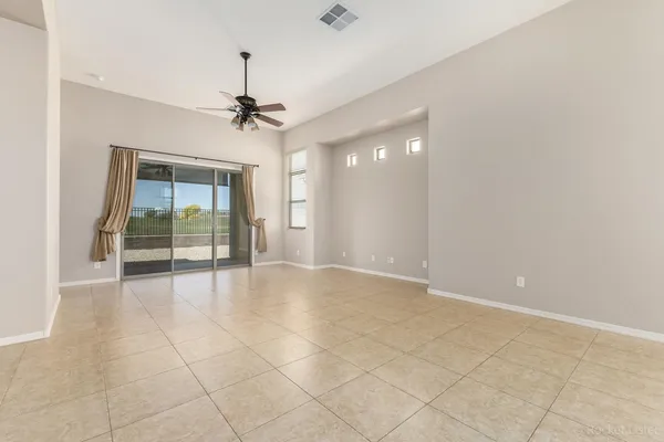 a kitchen with stainless steel appliances granite countertop a stove top oven a refrigerator a sink and dishwasher with wooden cabinets