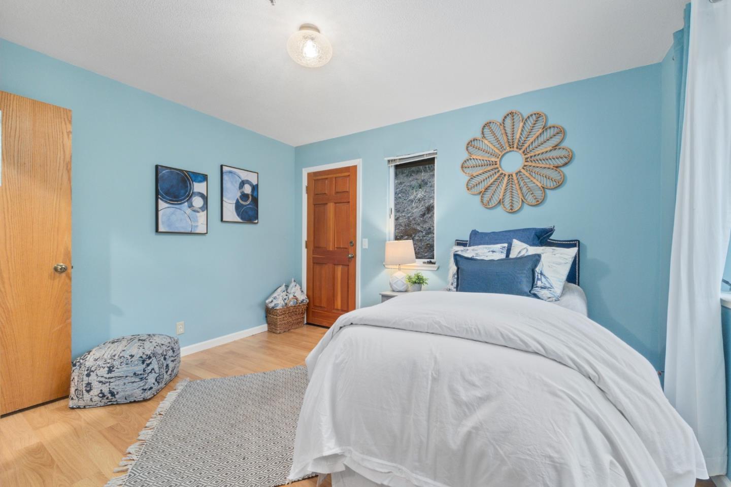 2345 Laurel Glen Road Soquel, CA 95073 - Photo 19 of 63 a bedroom with a bed and a painting on the wall
