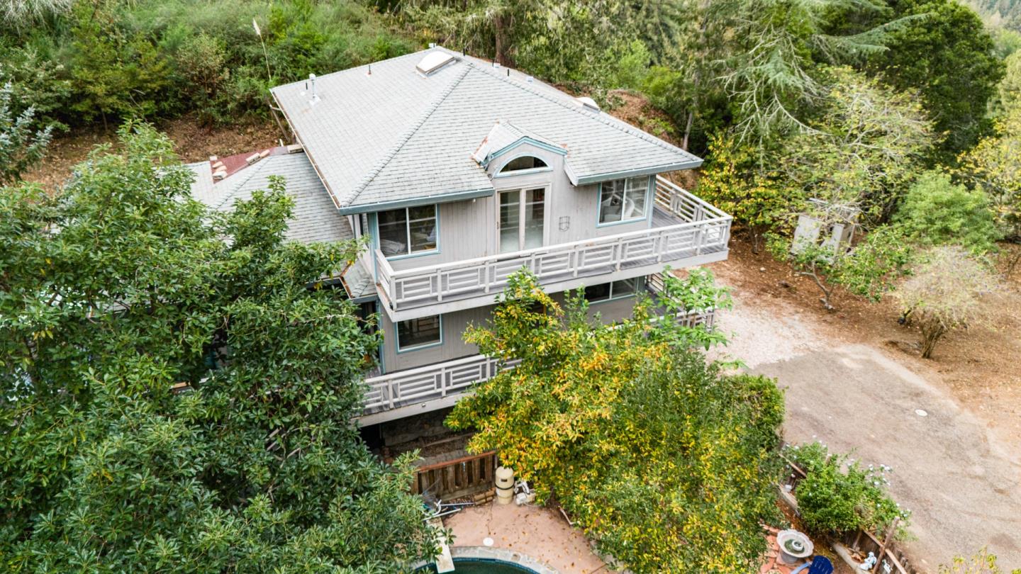2345 Laurel Glen Road Soquel, CA 95073 - Photo 2 of 63 an aerial view of a house with a yard and large trees