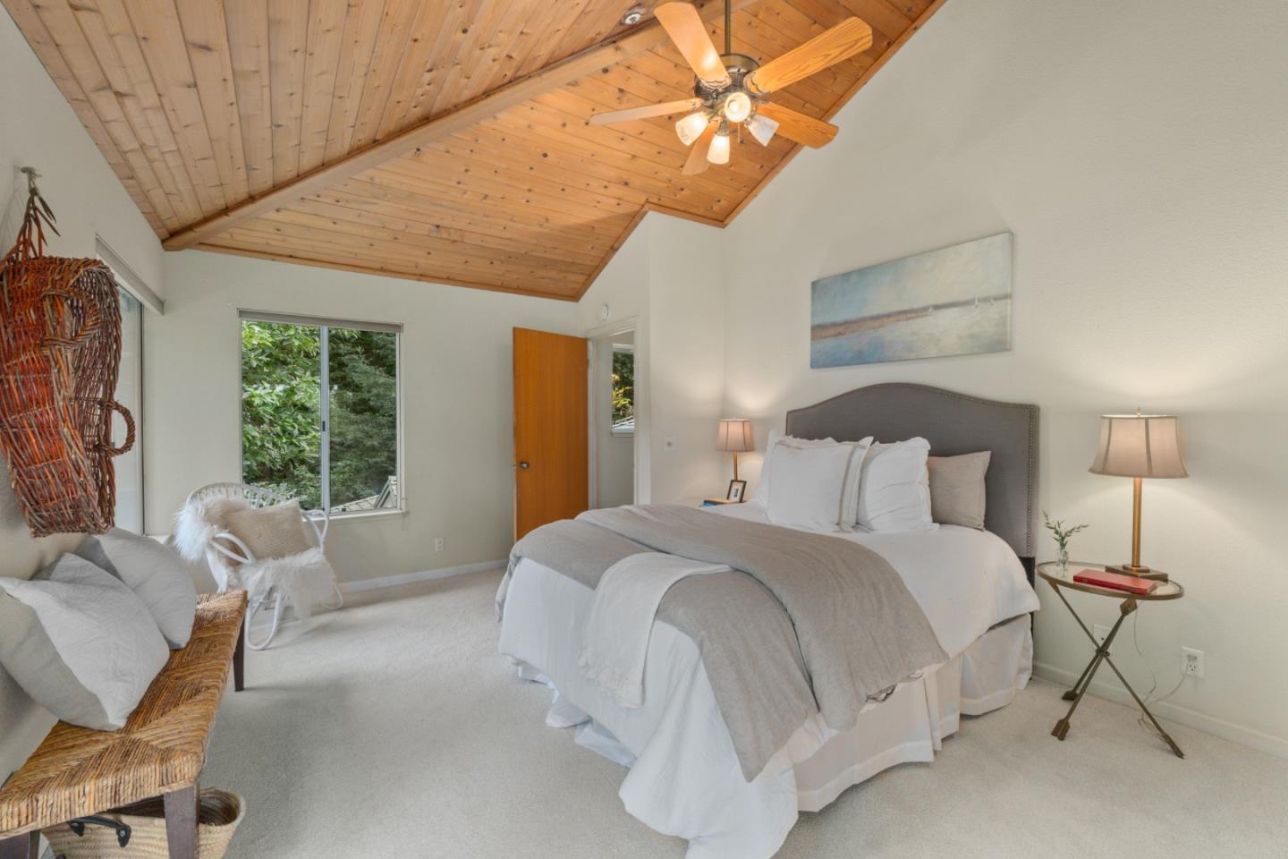 2345 Laurel Glen Road Soquel, CA 95073 - Photo 25 of 63 a bedroom with a bed and a chandelier
